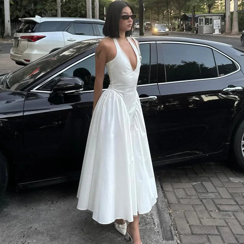 TARUXY Sexy Deep V Hollow Halterneck Large Hem Dress For Women Solid High Waisted Backless Splice Summer New Vacation Long Dress
